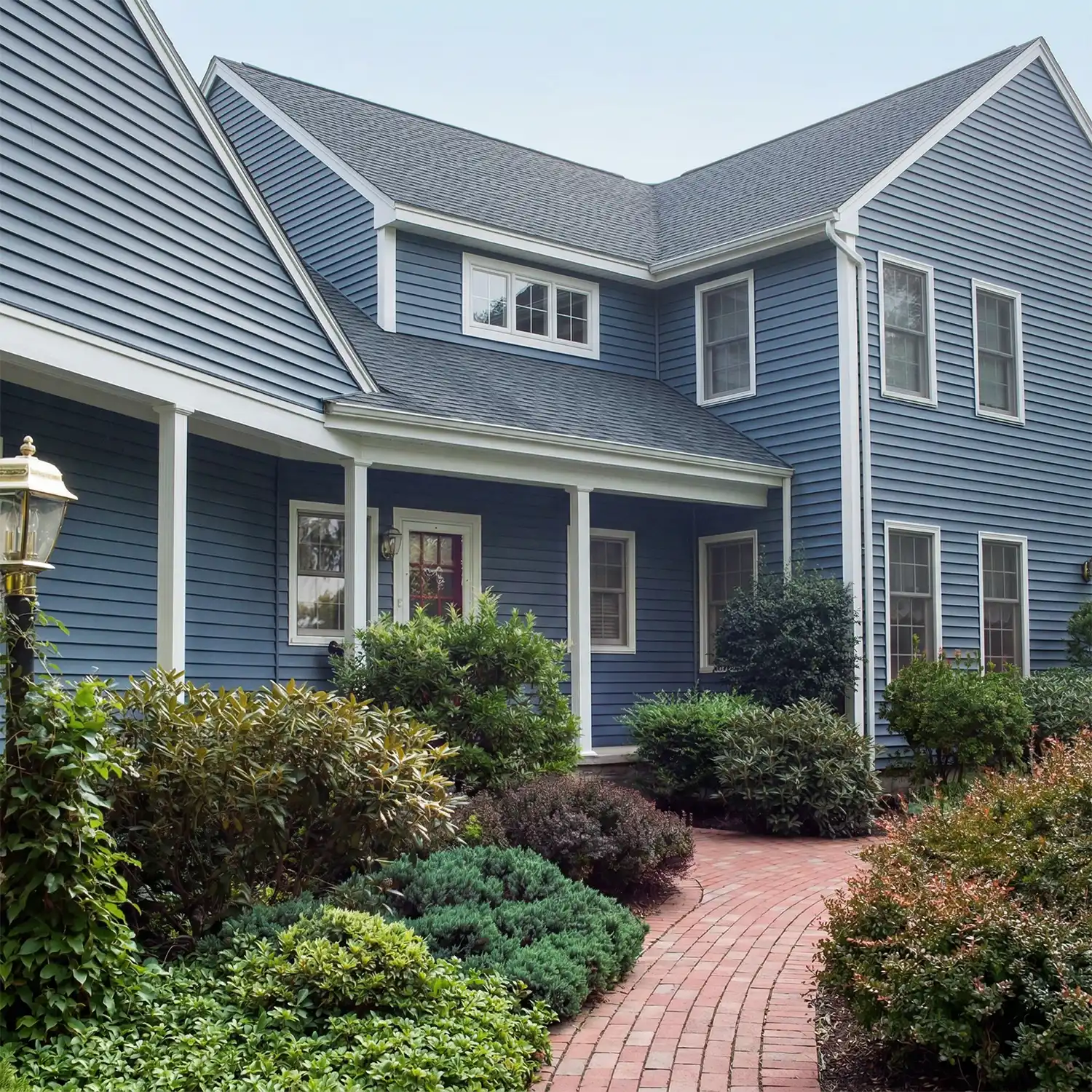 house with blue siding and new roof
