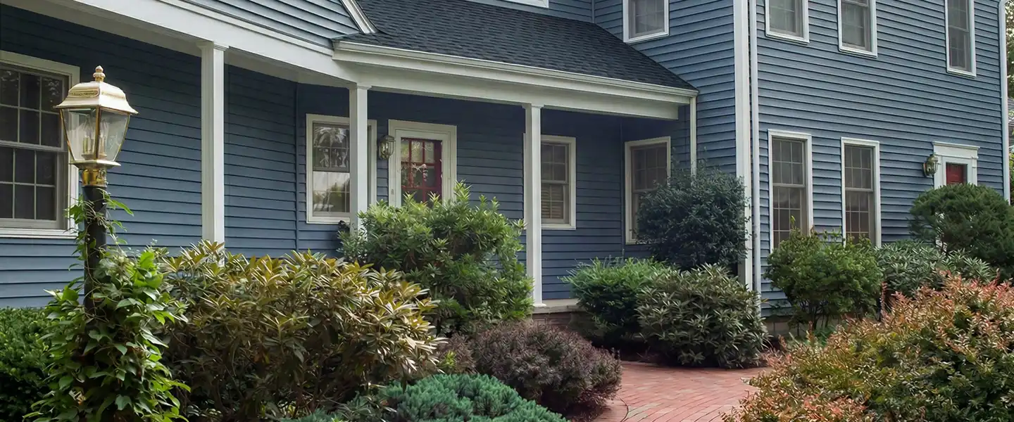 house with blue siding and new roof